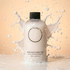 Pure'AM pH Balance Calming Toner in a clear bottle with a light-colored liquid, designed for soothing and balancing skin.